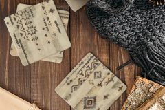 Autumn composition. Cup of tea, women fashion scarf, gift box, firewood on wooden background. Flat lay, top view, copy space. Scandinavian hygge concept.